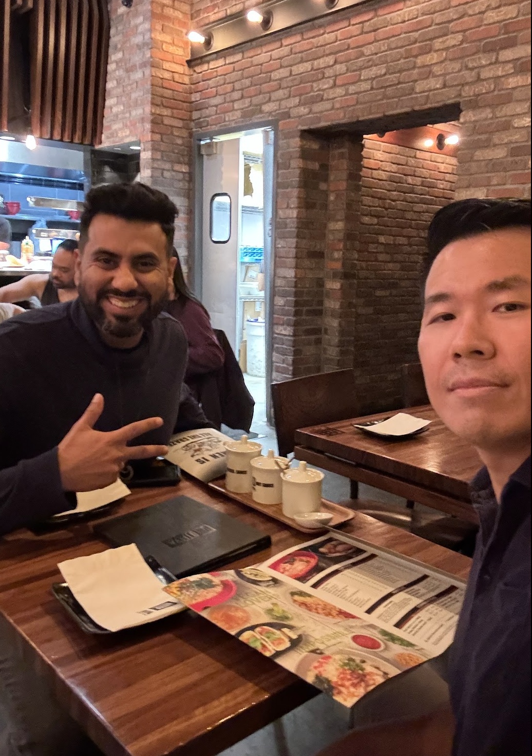 Mike Ke coaching at a restaurant in India